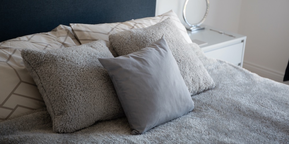 Grey pillows on a bed
